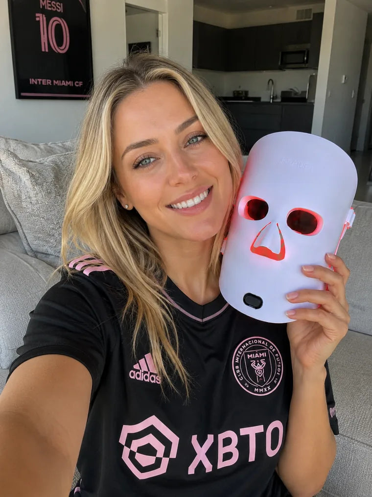 Chloe holding The Aura™ mask