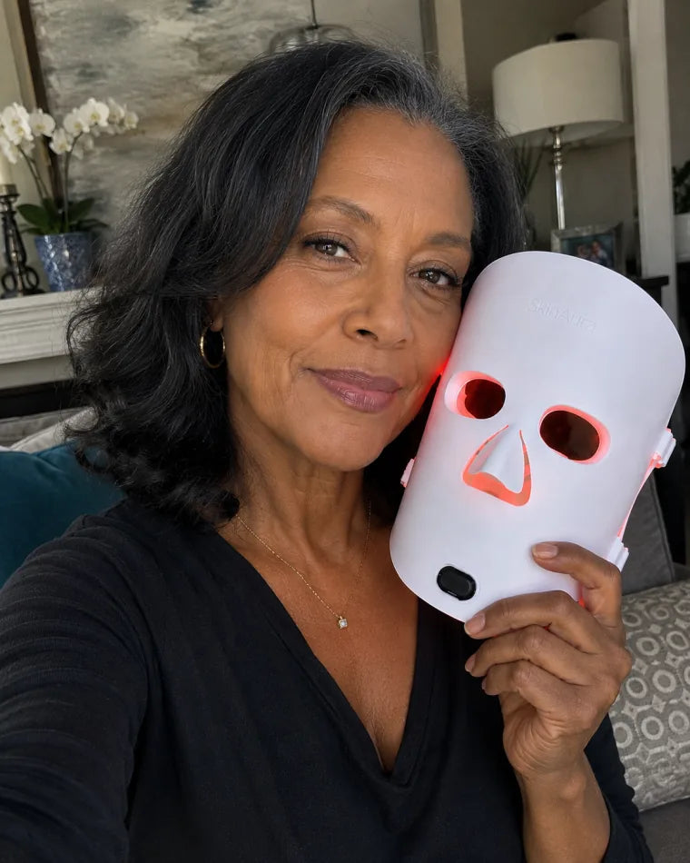 Amara holding The Aura™ mask