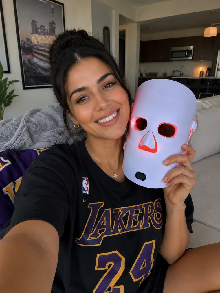 Mia holding The Aura™ mask