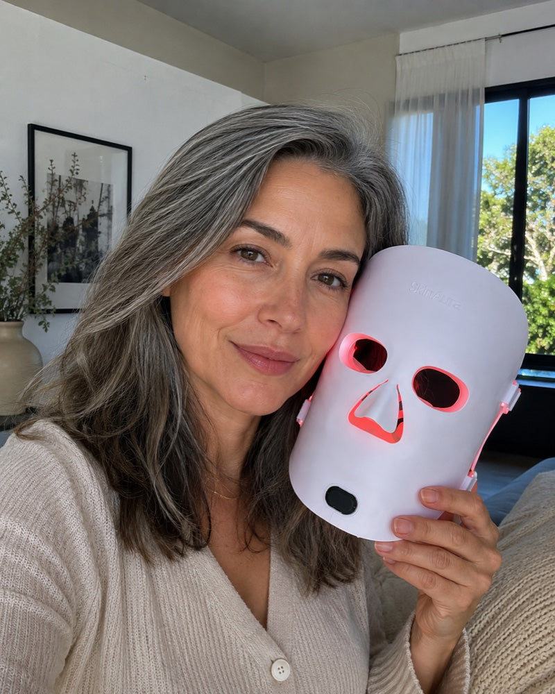 Reiko holding The Aura™ mask