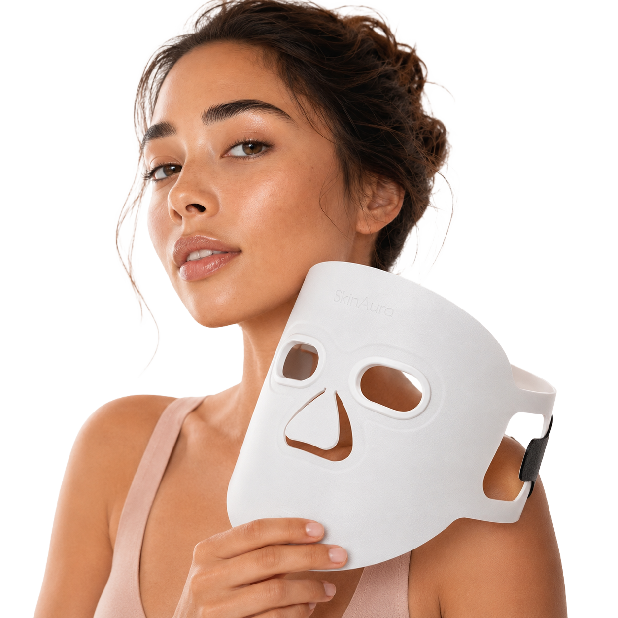A woman holding The Aura™ light-therapy mask